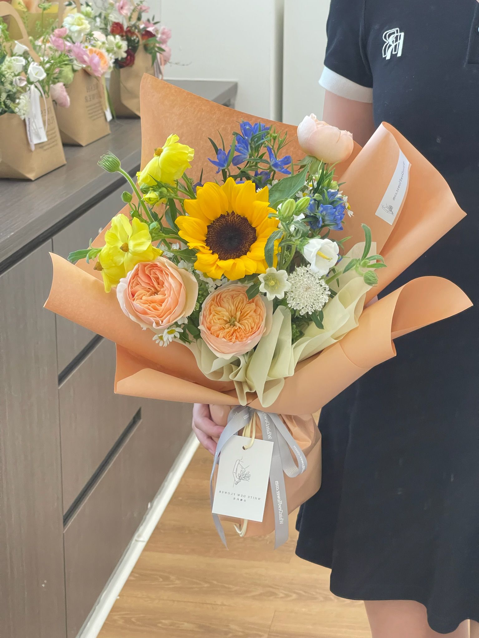 Make A Bold Statement with The Sunflower And Black Rose Bouquet