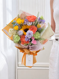 Chasing Dreams colourful graduation bouquet featuring sunflower, orange roses, yellow spray roses and purple lisianthus in Singapore.