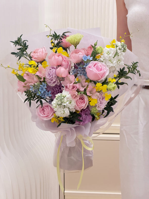 Pastel Sunshine bouquet with pink roses, yellow Oncidium orchids, lavender lisianthus and blue oxypetalum in Singapore