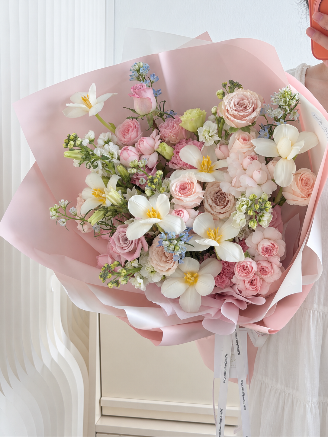 Blush Symphony mixed rose bouquet featuring white tulips, pink spray roses, white Matthiola and soft blue flowers