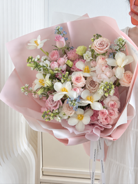Blush Symphony mixed rose bouquet featuring white tulips, pink spray roses, white Matthiola and soft blue flowers