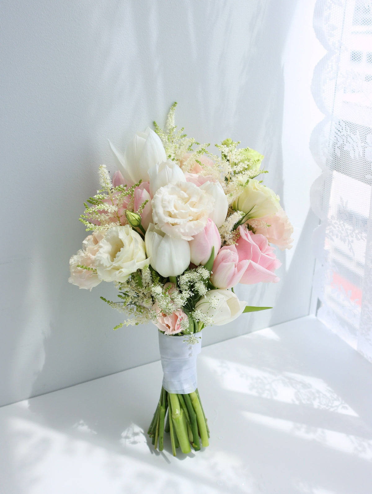 bouquet of pastel pink flowers for a bridal bouquet